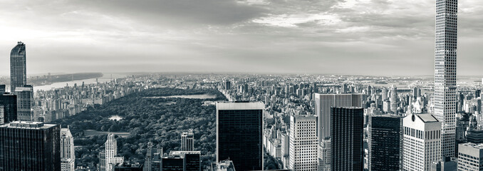 Panorama cityscape view on Central Park, New York, seen from the Rockefeller building "Top of the Rocks" before summer sunset.