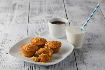 muffins with lemons on wooden table
