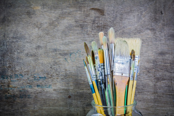 Paintbrushes in a glass jar