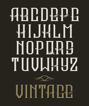 Hand drawn vector vintage typeface. Old style font on dark background