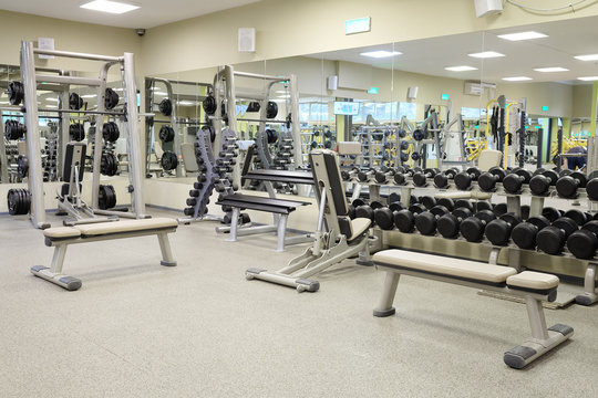 Interior of a fitness hall with wights and other sport equipment
