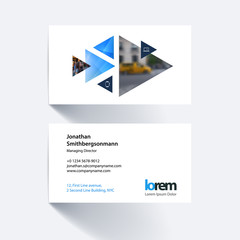 Vector business card template with moving triangles and arrows f