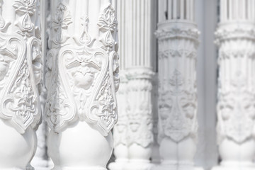 Background of white columns with ornate ornament