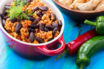 Homemade spicy stew with chili peppers, meat, and kidney beans