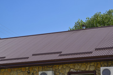 Fototapeta na wymiar The roof of corrugated sheet
