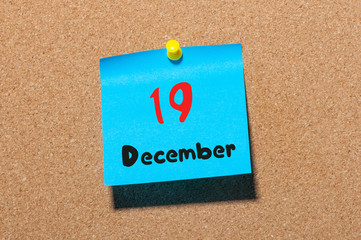 December 19th. Day 19 of month, Calendar on cork notice board. Winter time. Empty space for text