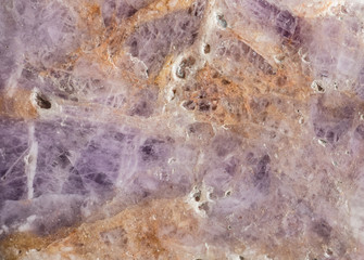 Surface of natural mineral transparent quartz with pink tourmaline or rubellite crystals.