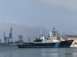 Civil patrol boat with helicopter landing side and speed boats o