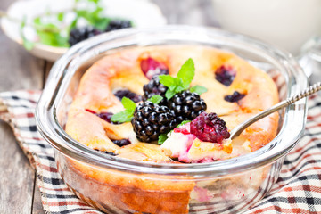 Cake  with blackberries on wooden table