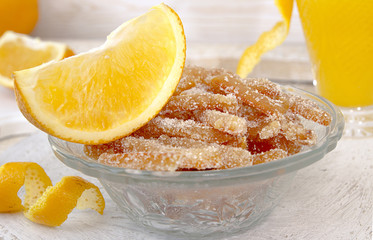 Homemade candied orange peels in glass bowl