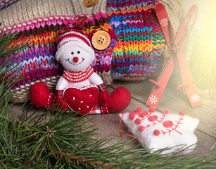 Christmas decoration snowman on wooden background