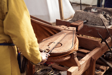 The annual festival in Kolomenskoye. Reconstruction of Ancient Rus. Blacksmith blows the bellows