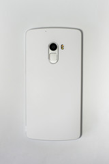 Blank back of a modern phone. White smartphone on a white background.