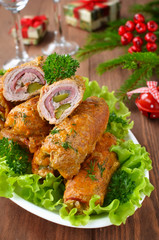 Meat rolls stuffed with bacon and pickled cucumber