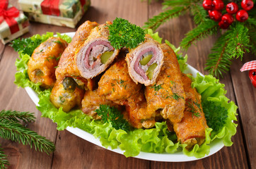 Meat rolls stuffed with bacon and pickled cucumber