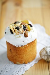 Easter composition with quail eggs nuts dried fruits holiday cake and willow branches on wooden table