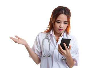 Asian young doctor woman upset with  mobile phone.