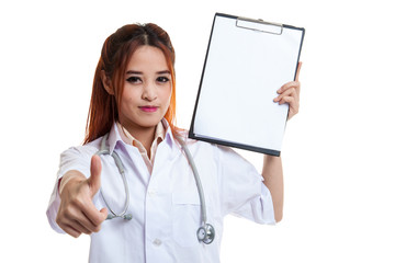 Young Asian female doctor thumbs up with a blank clipboard.