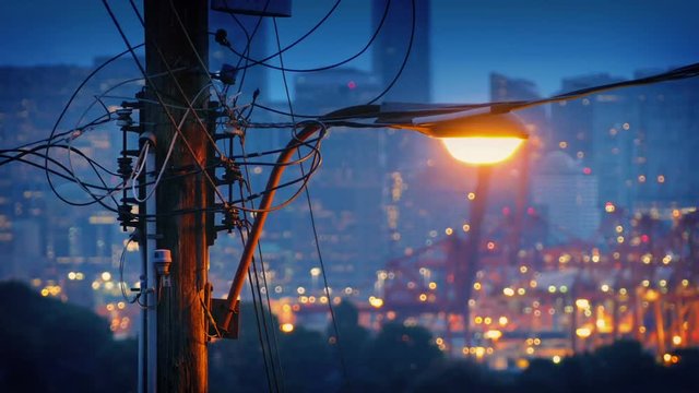 Streetlight With City Twinkling In Background