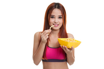 Beautiful Asian healthy girl eat  french fries.