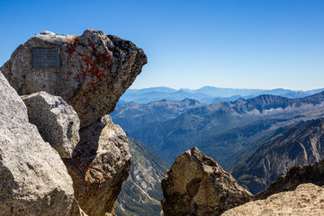 Rock and iron plate sign above Presena Peak