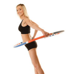 Fototapeta na wymiar sporty fit girl doing exercise with hula hoop.