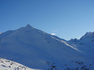 Fototapeta na wymiar Winter snow covered mountain peaks in Europe. Great place for sports