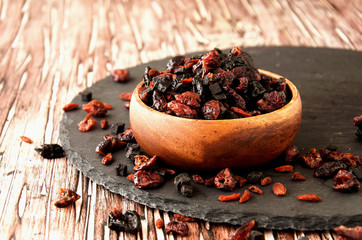 sliced dried fruits in a wooden bowl on the table