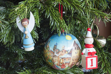 Detail of Christmas decoration hanging on pine tree