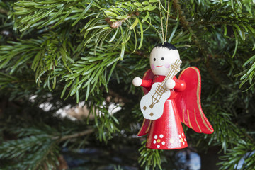 Detail of Christmas decoration hanging on pine tree