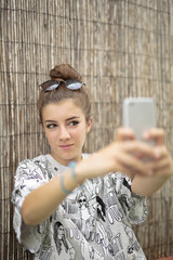 Young girl with mobile in hand