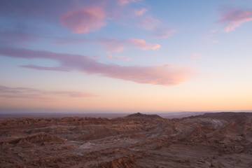 Fototapeta na wymiar Sunset at dusk looking out over Moon Valley, San Pedro De Atacama, Chile