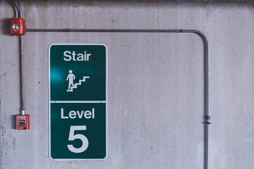 Concrete wall stair sign