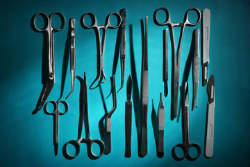 Flat lay of medical instruments on blue background