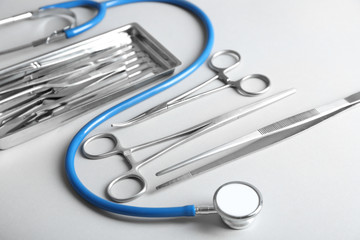 Flat lay of surgery instruments on white background