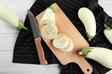 Sliced white eggplant on cutting board