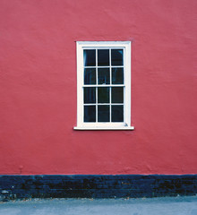 White House Window and Red Painted Home