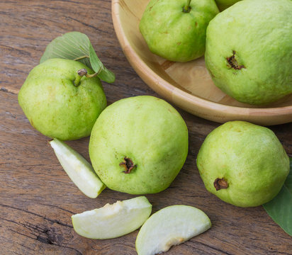 Green Guava On Wooden Plate