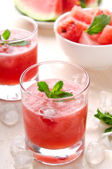 Healthy watermelon smoothie with mint and ice in glass