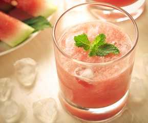 Healthy watermelon smoothie with mint and ice in glass
