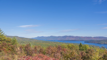 The deep blue color of Lake George is complemented by fall colors on a sunny mid-October afternoon.  

