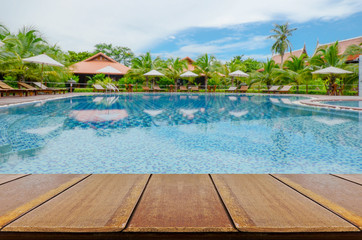 Blurred Swimming Pool Background with Perspective Wood Floor.