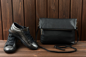 Leather upper metallic womens shoes and black leather bag on bro