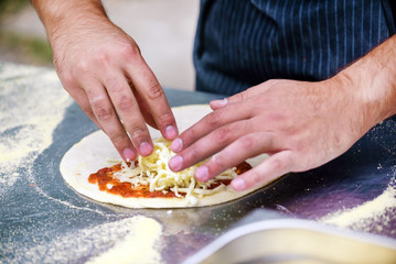 chef making pizza