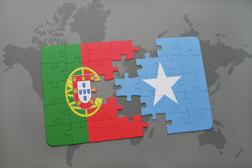 puzzle with the national flag of portugal and somalia on a world map background.