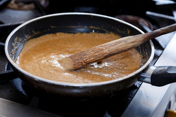 Curry soup is cooked in a pan.