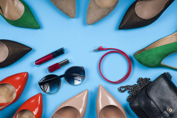 Women accessories and shoes on light background. Top view.
