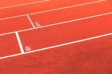 Red running track in stadium.