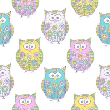 Seamless vector pattern with cartoon doodle owls. Cute birds with hand drawn floral ornament. Pastel color owls on white background. Nice design for kids.