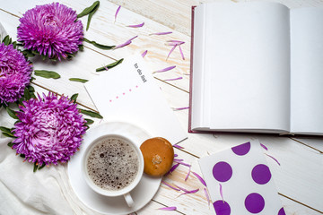 Word relax with cup of coffee and pink flowers
